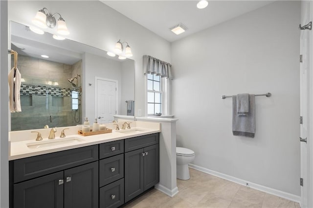 full bathroom featuring a sink, baseboards, a stall shower, and double vanity