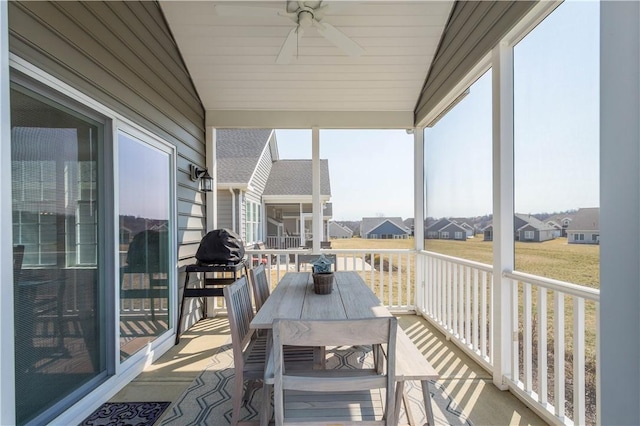 exterior space featuring a ceiling fan and vaulted ceiling