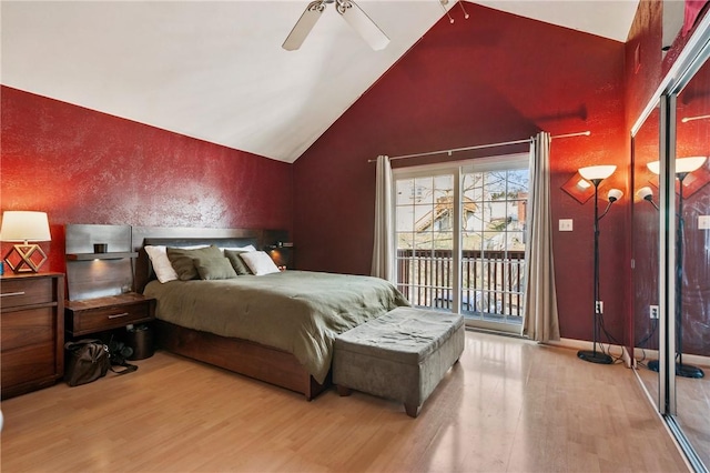 bedroom featuring access to exterior, ceiling fan, lofted ceiling, and wood finished floors