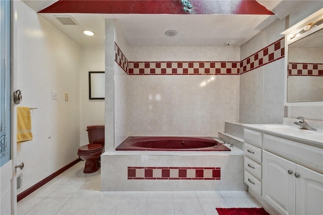 bathroom featuring vanity, visible vents, tile patterned floors, a bath, and tile walls