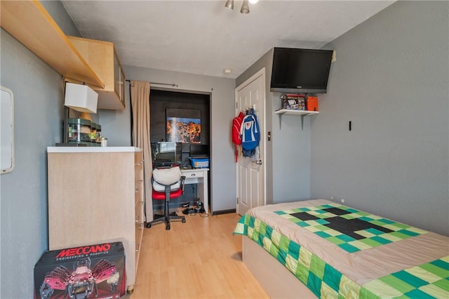 bedroom with light wood-style floors