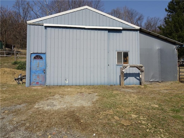view of pole building with fence