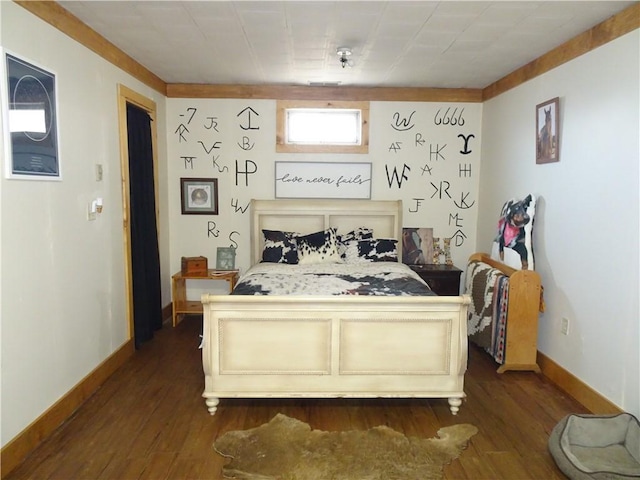 bedroom with baseboards and dark wood-style flooring