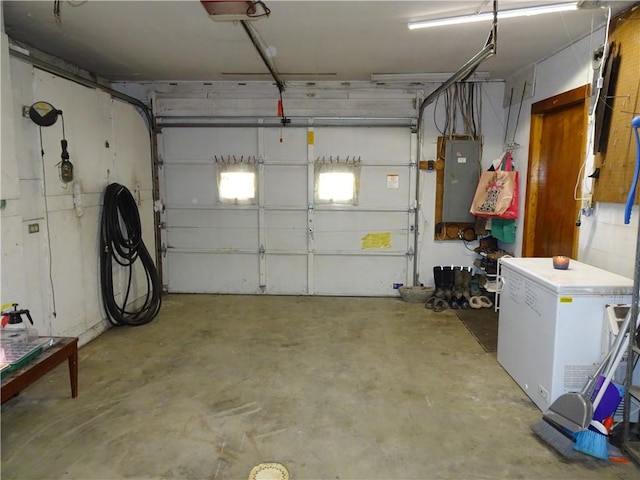 garage with electric panel and refrigerator