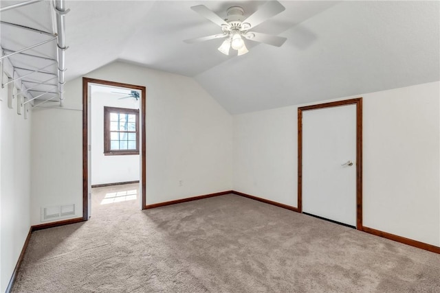 bonus room with visible vents, lofted ceiling, carpet, and ceiling fan