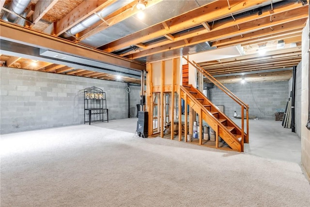 unfinished basement featuring stairs