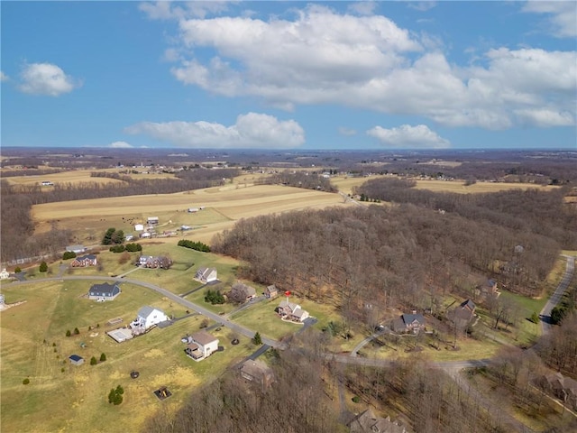 birds eye view of property with a rural view