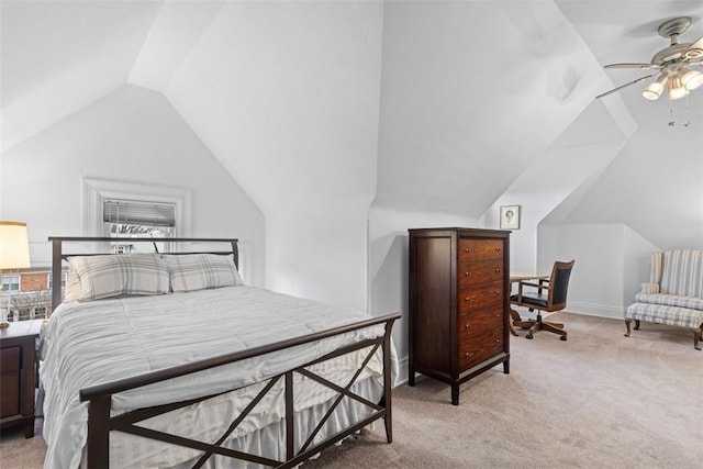 bedroom featuring vaulted ceiling, a ceiling fan, baseboards, and light carpet