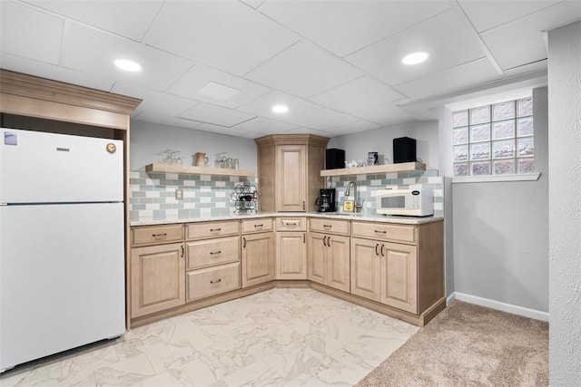 kitchen featuring white appliances, tasteful backsplash, and open shelves