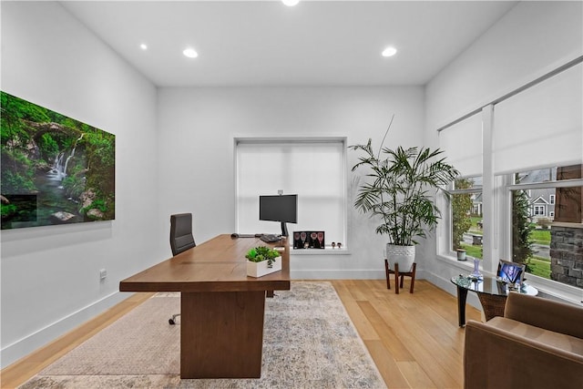 home office featuring recessed lighting, baseboards, and light wood finished floors