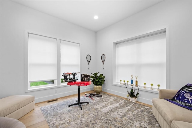 office area with recessed lighting, wood finished floors, visible vents, and baseboards