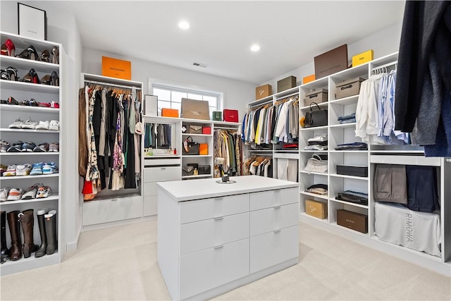 spacious closet with visible vents and light carpet