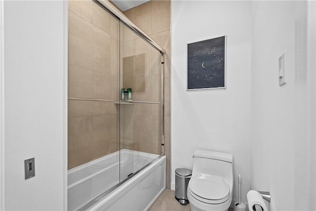 full bathroom with combined bath / shower with glass door, toilet, and baseboard heating