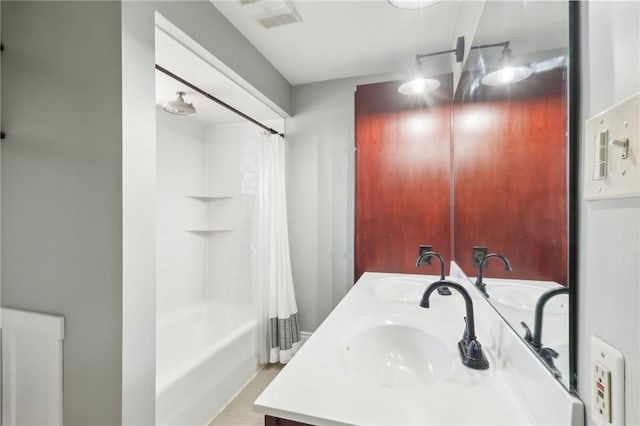 full bath with a sink, visible vents, double vanity, and shower / bath combination with curtain