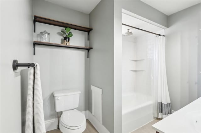 bathroom featuring shower / bathtub combination with curtain and toilet