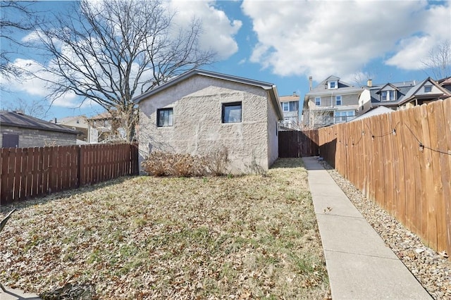 view of home's exterior featuring stucco siding and a fenced backyard