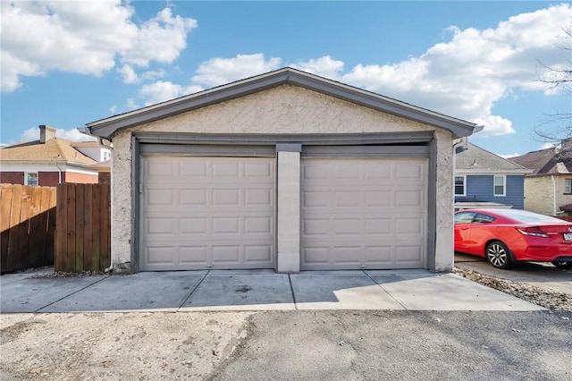 garage with fence