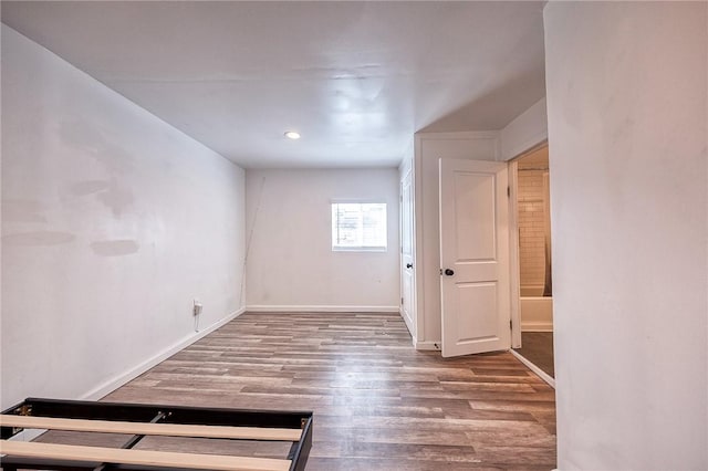 interior space featuring wood finished floors and baseboards