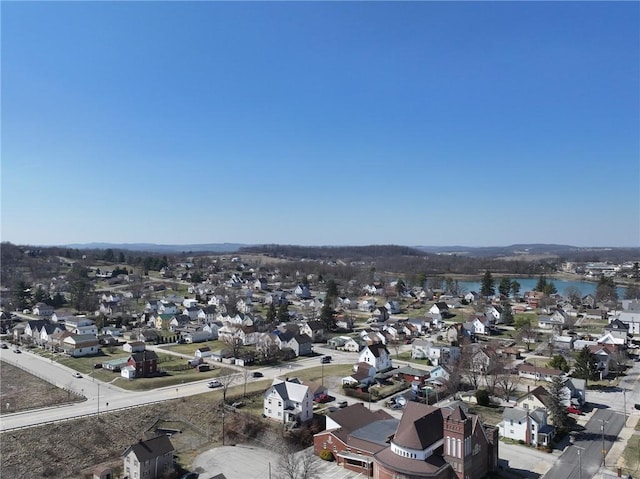 birds eye view of property with a residential view and a water view