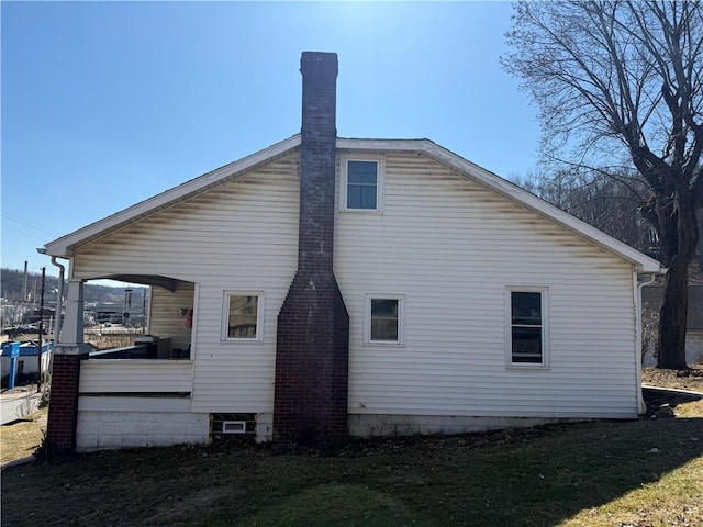 back of property with covered porch