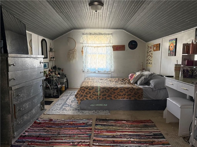 bedroom featuring lofted ceiling and wood ceiling