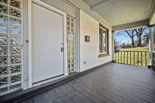 entrance to property featuring a porch