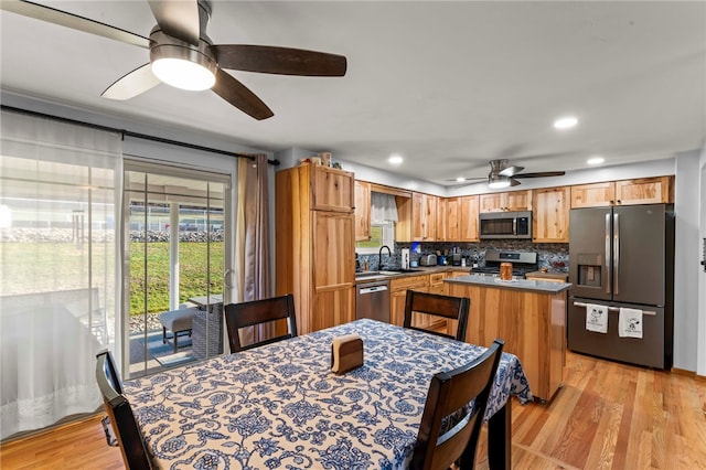 dining room with recessed lighting, light wood-style floors, and ceiling fan