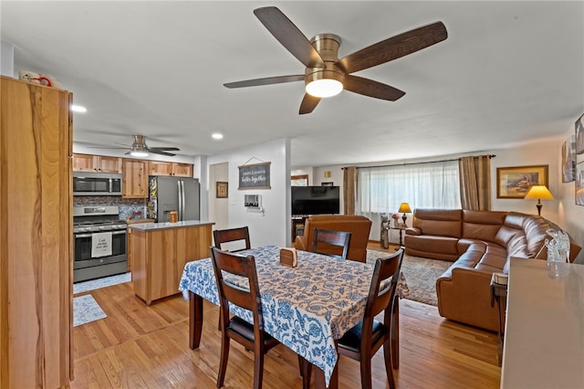 dining room with recessed lighting, light wood-type flooring, and ceiling fan