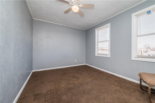 unfurnished room with baseboards, ceiling fan, carpet floors, ornamental molding, and a textured ceiling