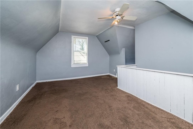 bonus room with vaulted ceiling, baseboards, a ceiling fan, and carpet floors