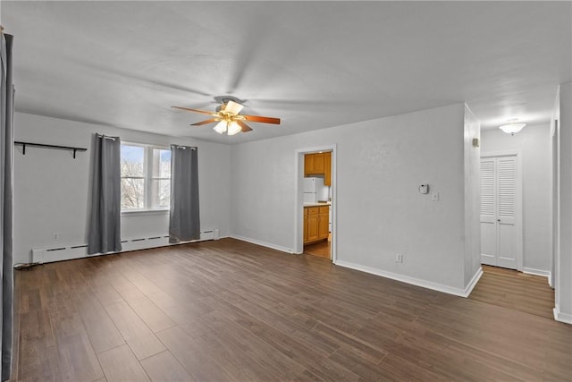 interior space featuring a baseboard radiator, baseboards, dark wood-style flooring, and ceiling fan