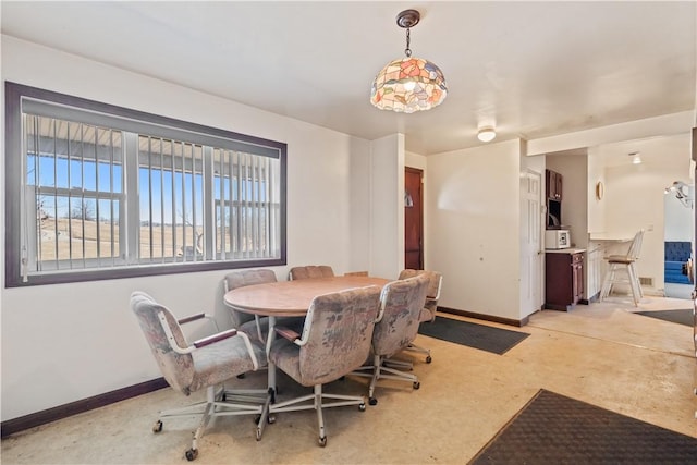 dining room featuring baseboards