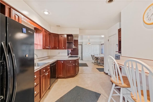 kitchen featuring open shelves, black appliances, light countertops, and a sink