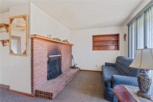 living room with baseboards, carpet floors, and a fireplace