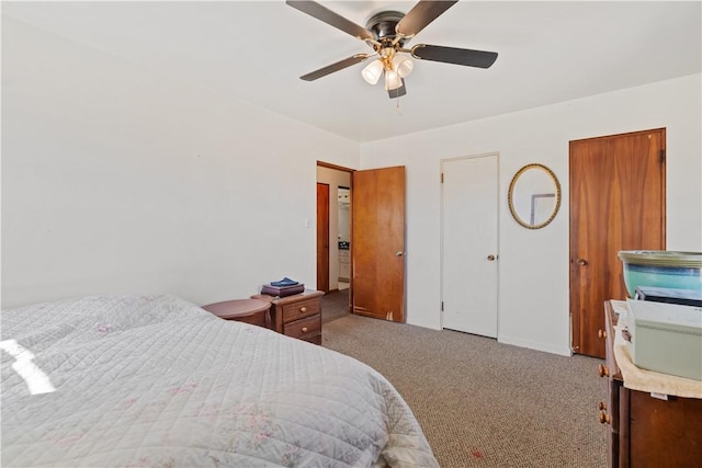 bedroom featuring carpet flooring, a ceiling fan, and multiple closets