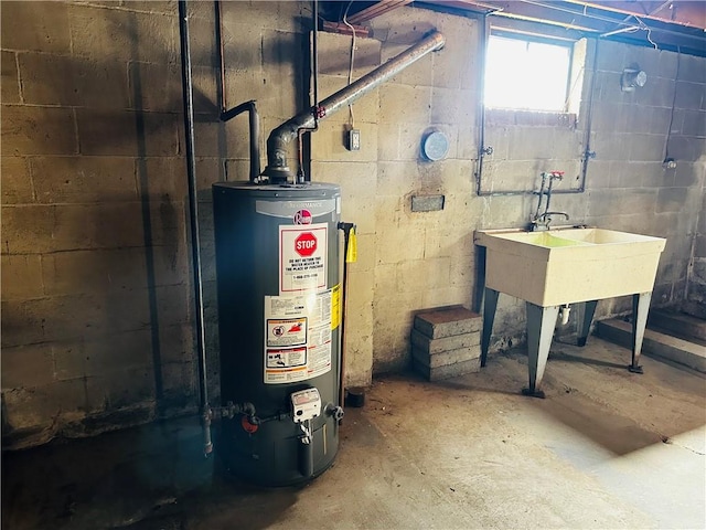 utility room featuring water heater