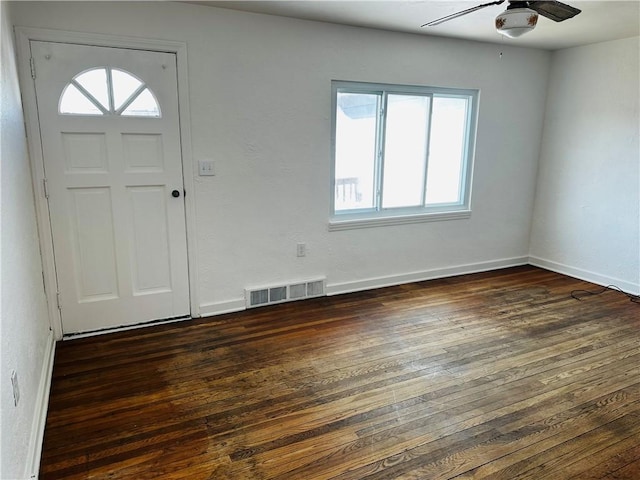 entrance foyer with visible vents, baseboards, dark wood-type flooring, and ceiling fan