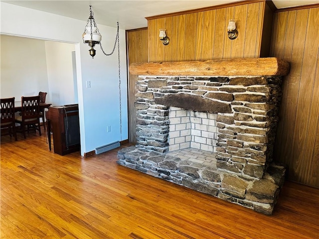 room details with a notable chandelier, baseboards, and wood finished floors