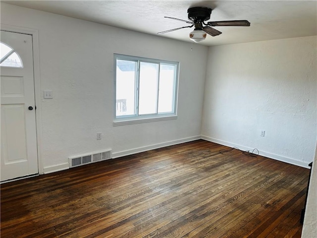 interior space with visible vents, wood-type flooring, baseboards, and a ceiling fan