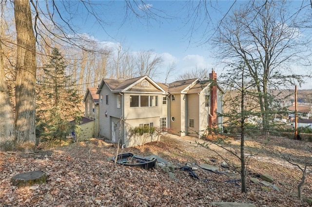 view of front of home featuring a chimney