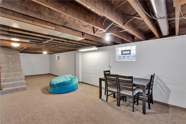 basement with stairway and carpet