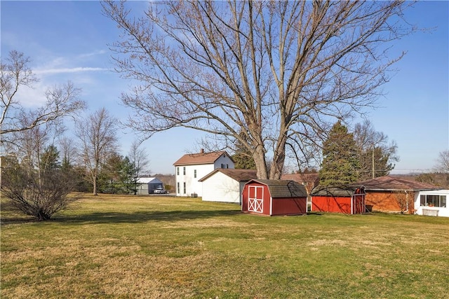 view of yard featuring an outbuilding and a shed