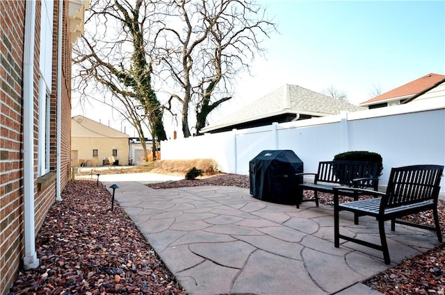 view of patio with fence and grilling area