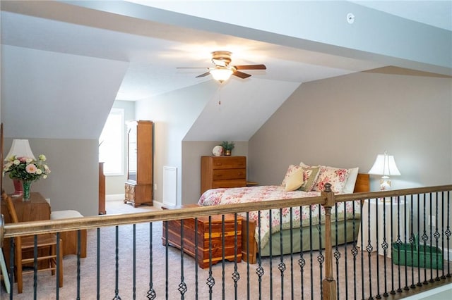 bedroom with baseboards, lofted ceiling, and carpet floors