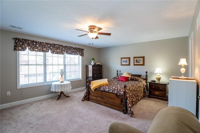 bedroom with ceiling fan, carpet, visible vents, and baseboards