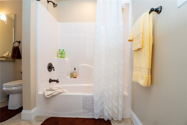 bathroom with shower / tub combo with curtain and toilet