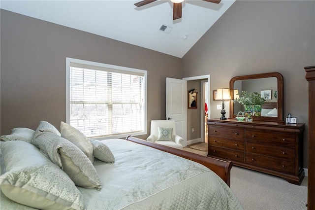 carpeted bedroom with visible vents, high vaulted ceiling, and ceiling fan