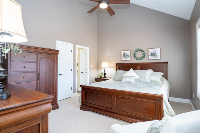 bedroom with baseboards, light carpet, high vaulted ceiling, and a ceiling fan