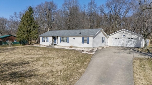 ranch-style home featuring a front lawn, entry steps, a detached garage, an outdoor structure, and crawl space