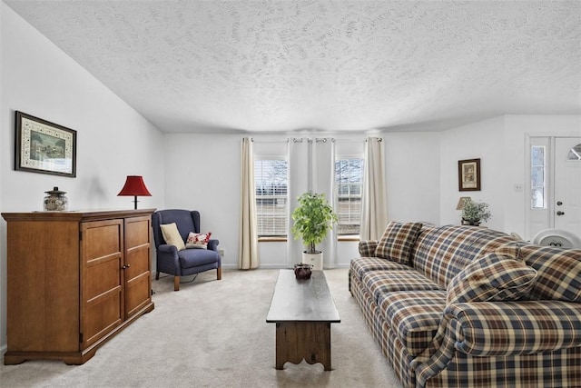 living room with light carpet and a textured ceiling